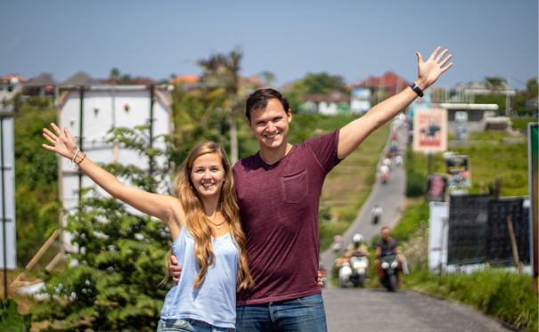 James and Danielle standing together with the Bali Canggu shortcut in the background